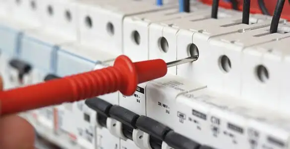 Electrical contractor testing circuit breakers during electrical repair in Cudahy, WI
