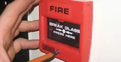 fire alarm installation service showing manual fire alarm pull station installed by licensed electricians in Milwaukee, WI