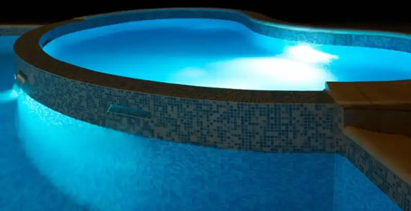 pool light installation and repair services highlighting illuminated pool interior lighting in Milwaukee, WI