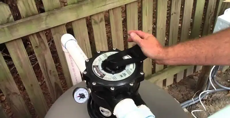 pool pumps service showing professional adjustment of pool pump control system in Milwaukee, WI