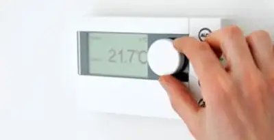 Thermostat installation service with professional adjusting temperature control in Milwaukee, WI