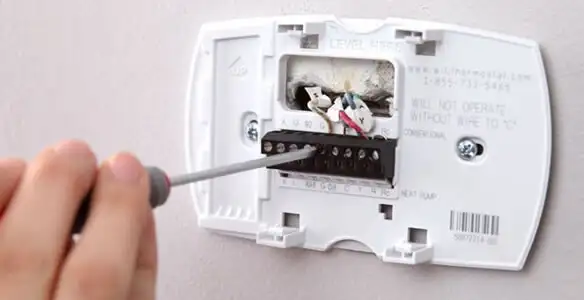 Thermostat installation service with proper wiring and secure wall mounting in Milwaukee, WI